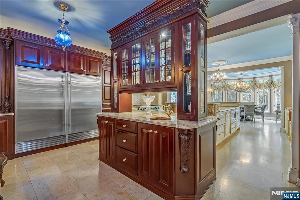 294 Oakwood Road Englewood, NJ 07631 - Photo 19 of 50 a kitchen with stainless steel appliances granite countertop a stove and cabinets