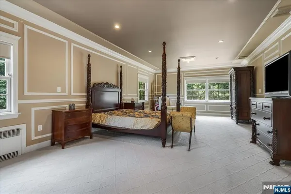a bedroom with furniture and a window