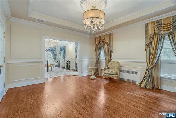 a view of a livingroom with wooden floor and stairs