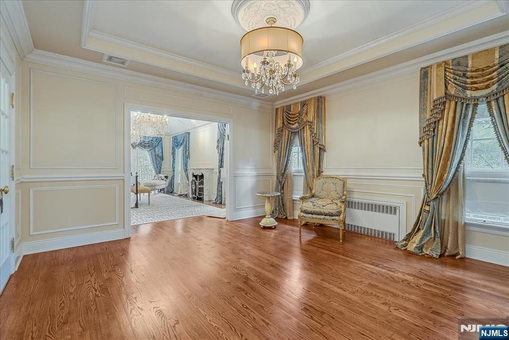 294 Oakwood Road Englewood, NJ 07631 - Photo 30 of 50 a view of a livingroom with wooden floor and stairs