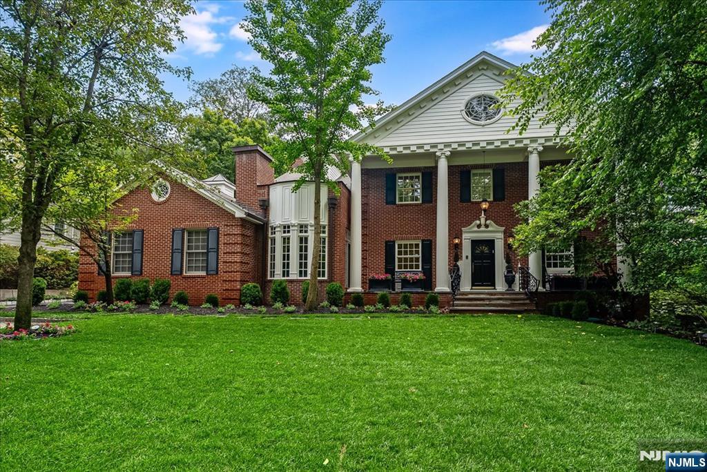 294 Oakwood Road Englewood, NJ 07631 - Photo 3 of 50 a front view of a house with garden