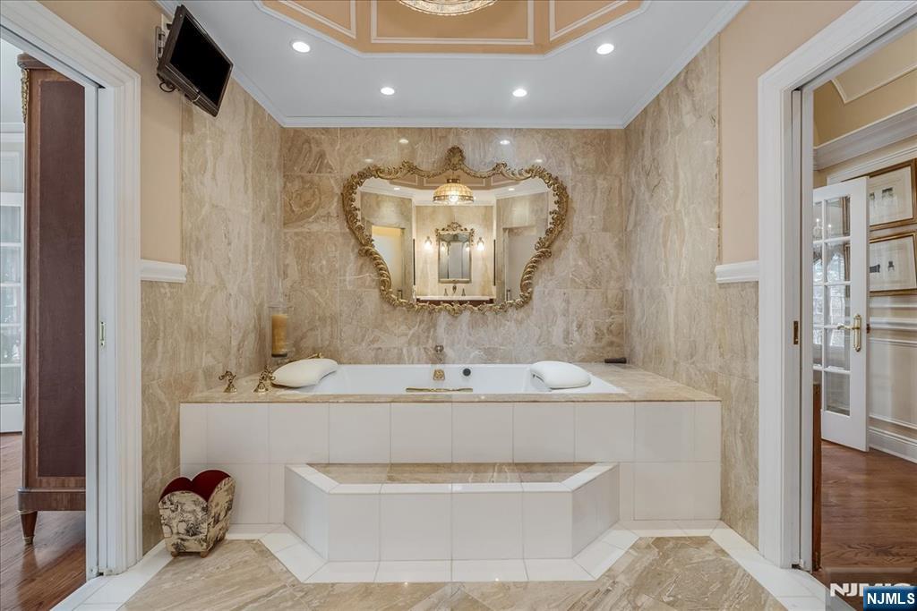 294 Oakwood Road Englewood, NJ 07631 - Photo 35 of 50 a bathroom with a sink and a mirror