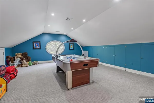 a room with furniture and a flat screen tv