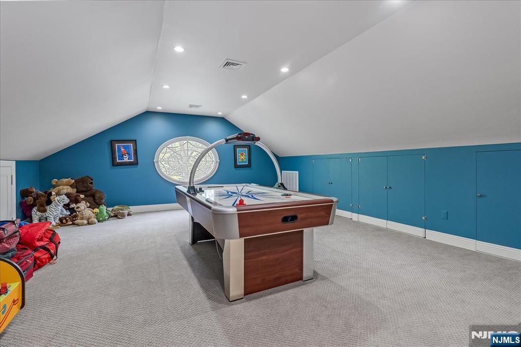 294 Oakwood Road Englewood, NJ 07631 - Photo 39 of 50 a room with furniture and a flat screen tv