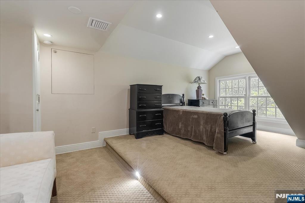 294 Oakwood Road Englewood, NJ 07631 - Photo 40 of 50 a living room with furniture and a flat screen tv