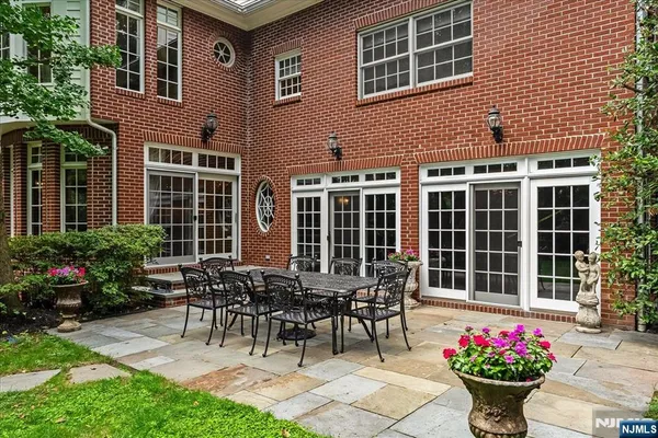 a view of a house with a table and chairs