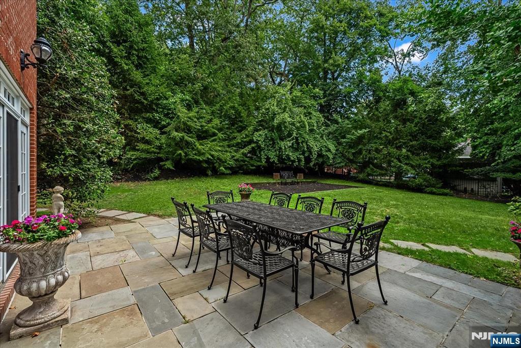 294 Oakwood Road Englewood, NJ 07631 - Photo 45 of 50 a patio with table and chairs