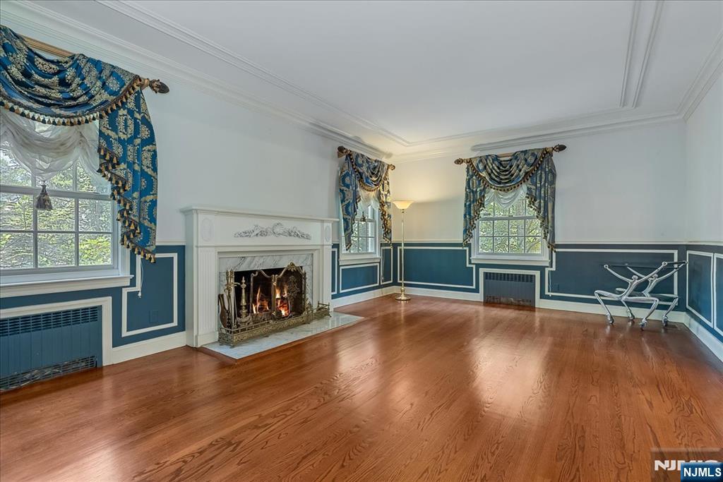 294 Oakwood Road Englewood, NJ 07631 - Photo 8 of 50 a living room with furniture and a fireplace