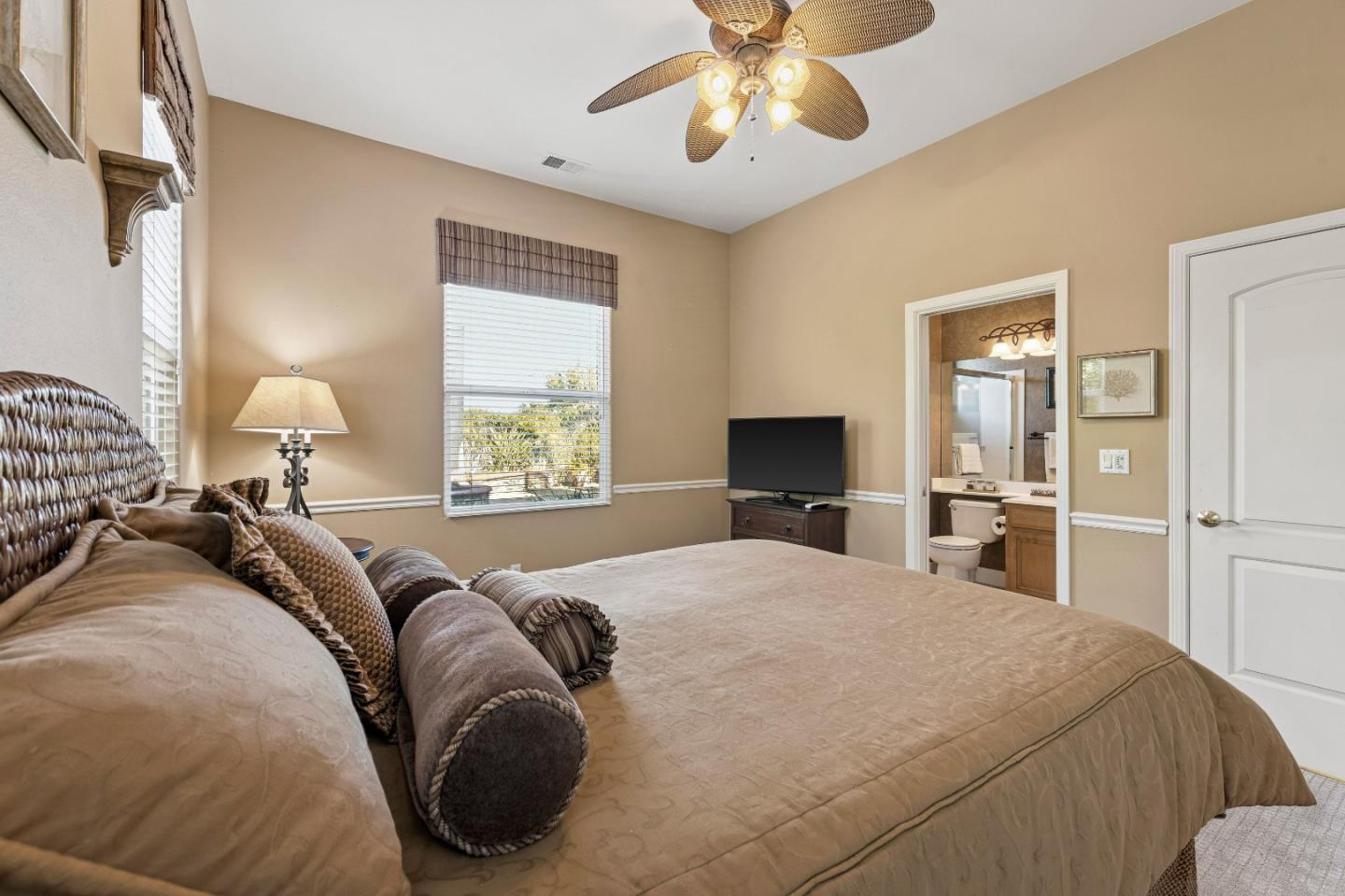 7466 Dunbar Court Gilroy, CA 95020 - Photo 36 of 103 a bedroom with a bed and a chandelier
