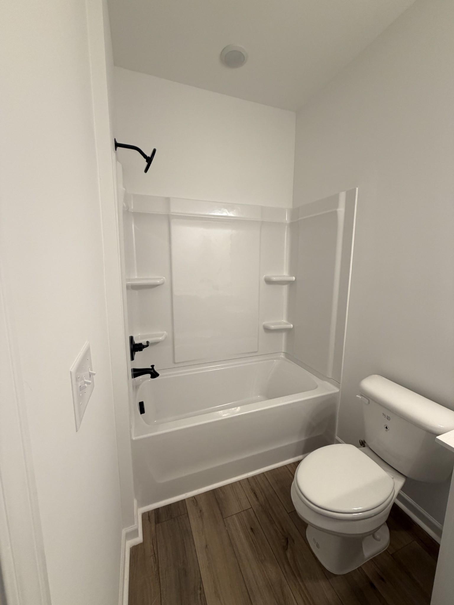 119 Yarrow Loop Clarksville, TN 37043 - Photo 25 of 25 a bathroom with a toilet and a bath tub