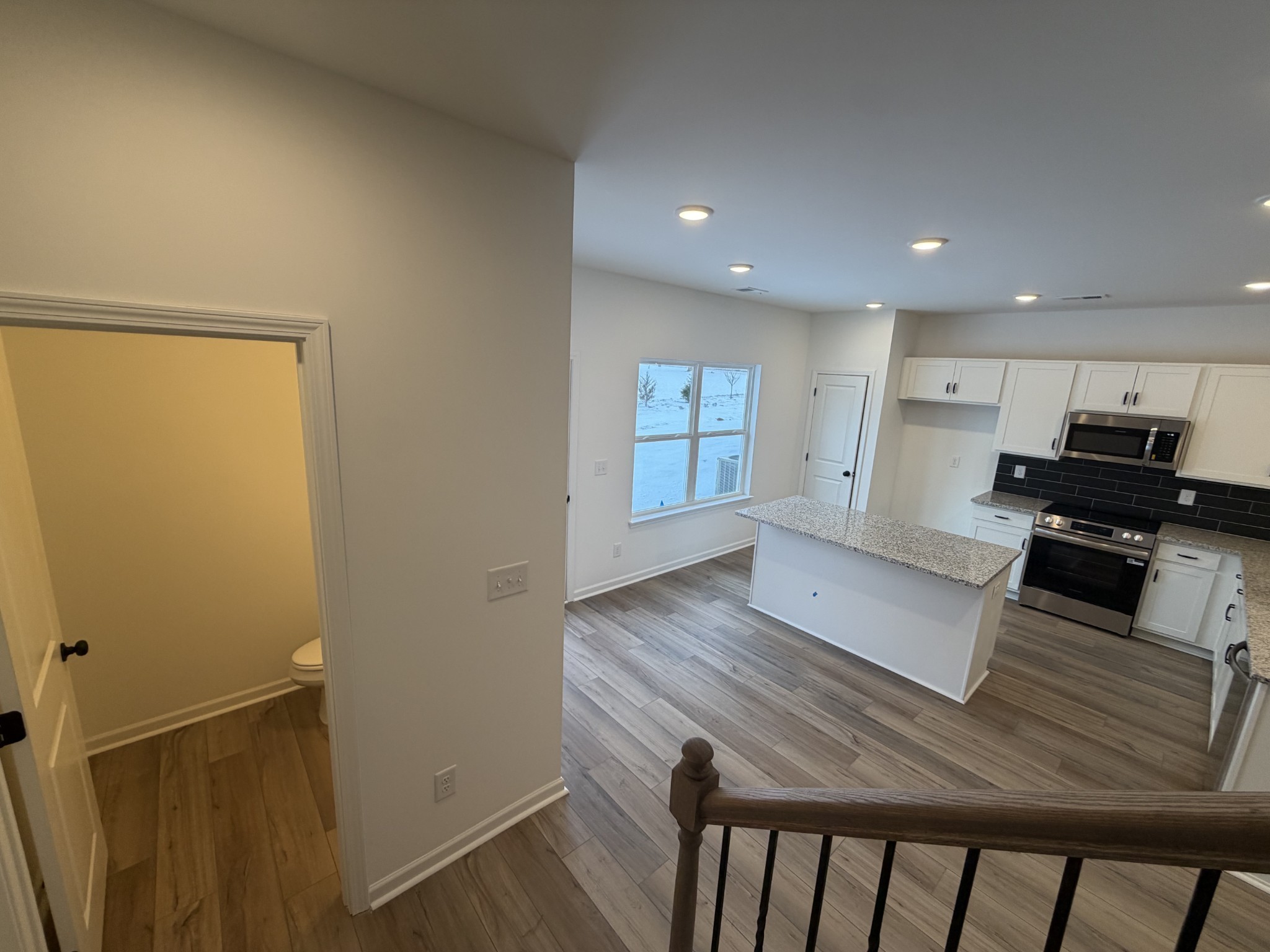 119 Yarrow Loop Clarksville, TN 37043 - Photo 7 of 25 a view of a kitchen with wooden floor and electronic appliances