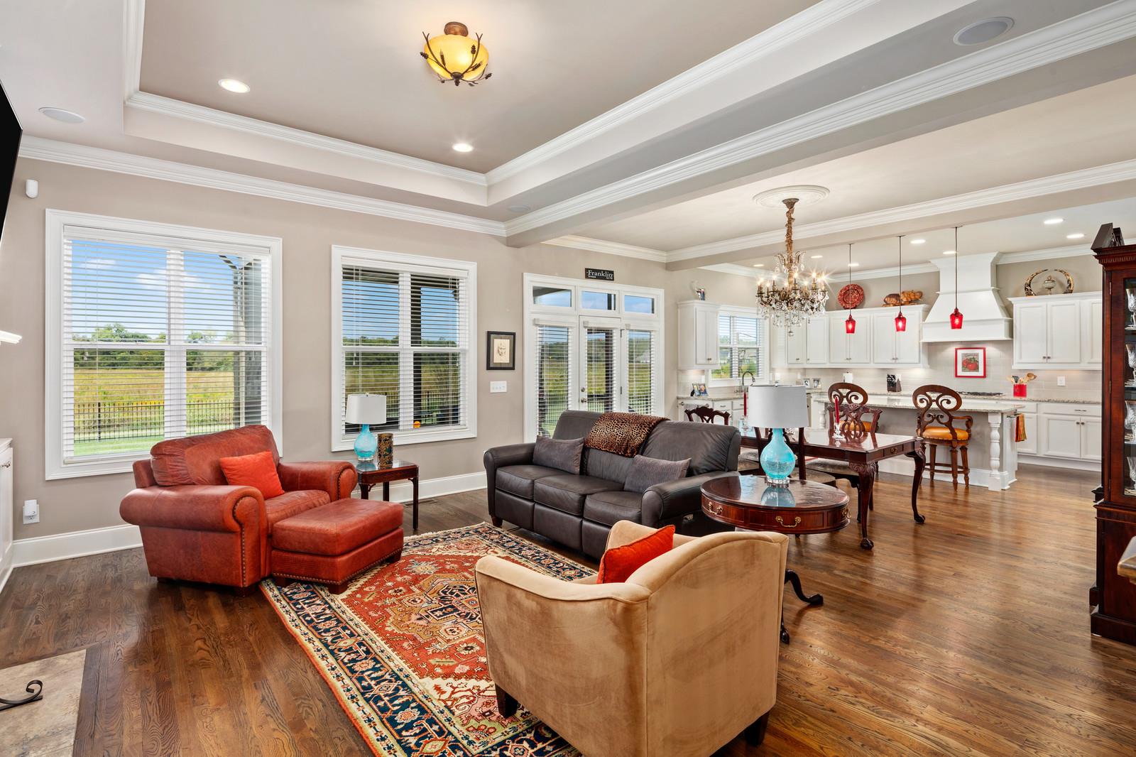 The open concept design of the home combines the family room, dining area, kitchen and doors to the covered screened porch for ease of entertaining.