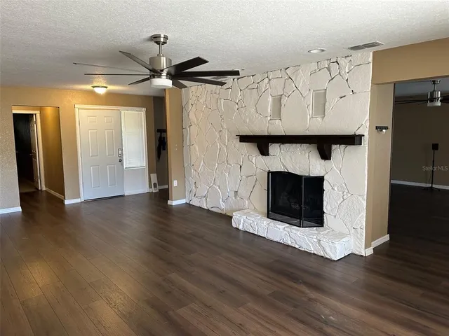a view of fireplace and wooden floor