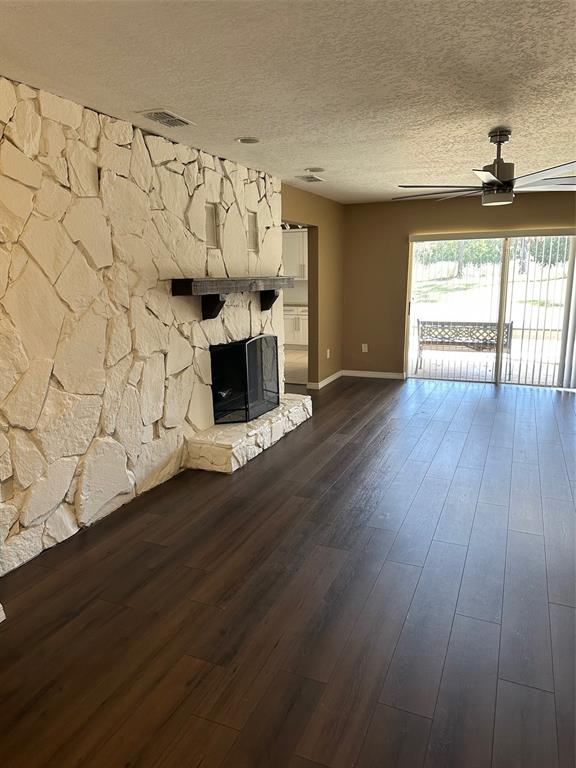 6848 Copperfield Drive New Port Richey, FL 34655 - Photo 13 of 20 a view of empty room with wooden floor and fan