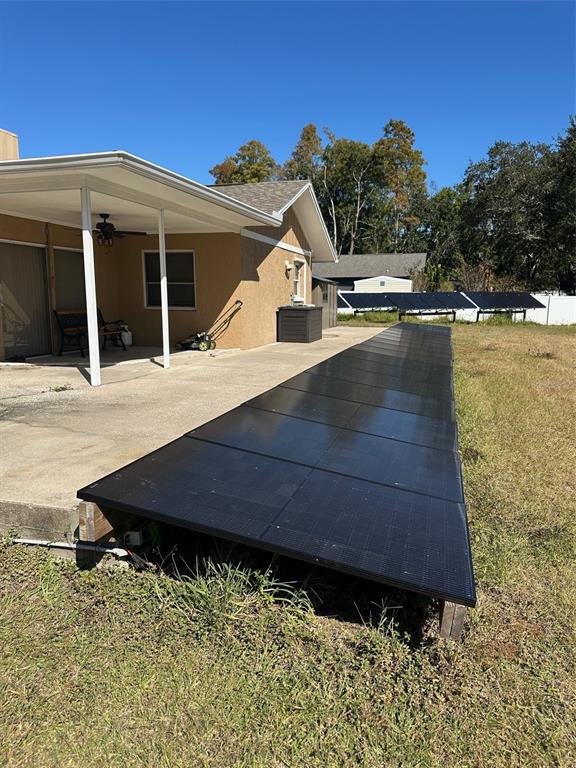 6848 Copperfield Drive New Port Richey, FL 34655 - Photo 15 of 20 a view of a house with a yard