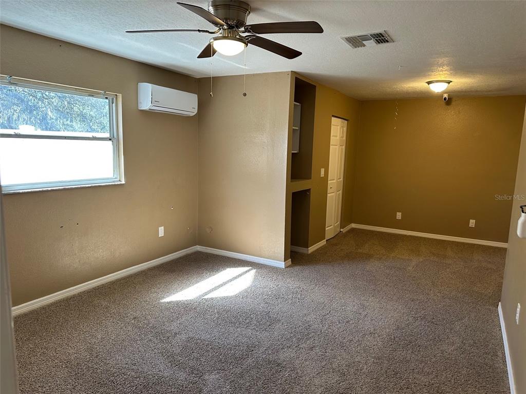 6848 Copperfield Drive New Port Richey, FL 34655 - Photo 20 of 20 a view of an empty room with a window