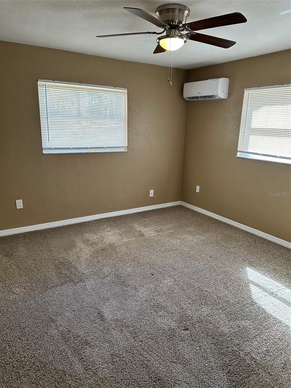 6848 Copperfield Drive New Port Richey, FL 34655 - Photo 10 of 20 a view of an empty room with a window