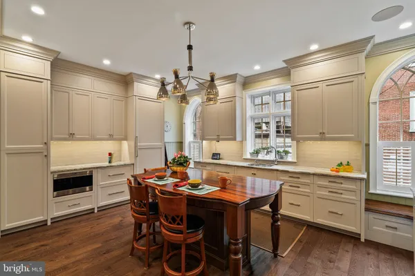a kitchen with a table and chairs in it