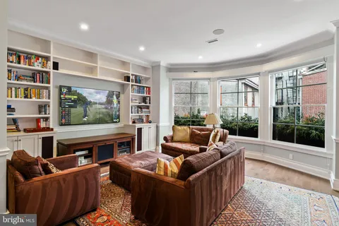 a bedroom with bed and wooden floor