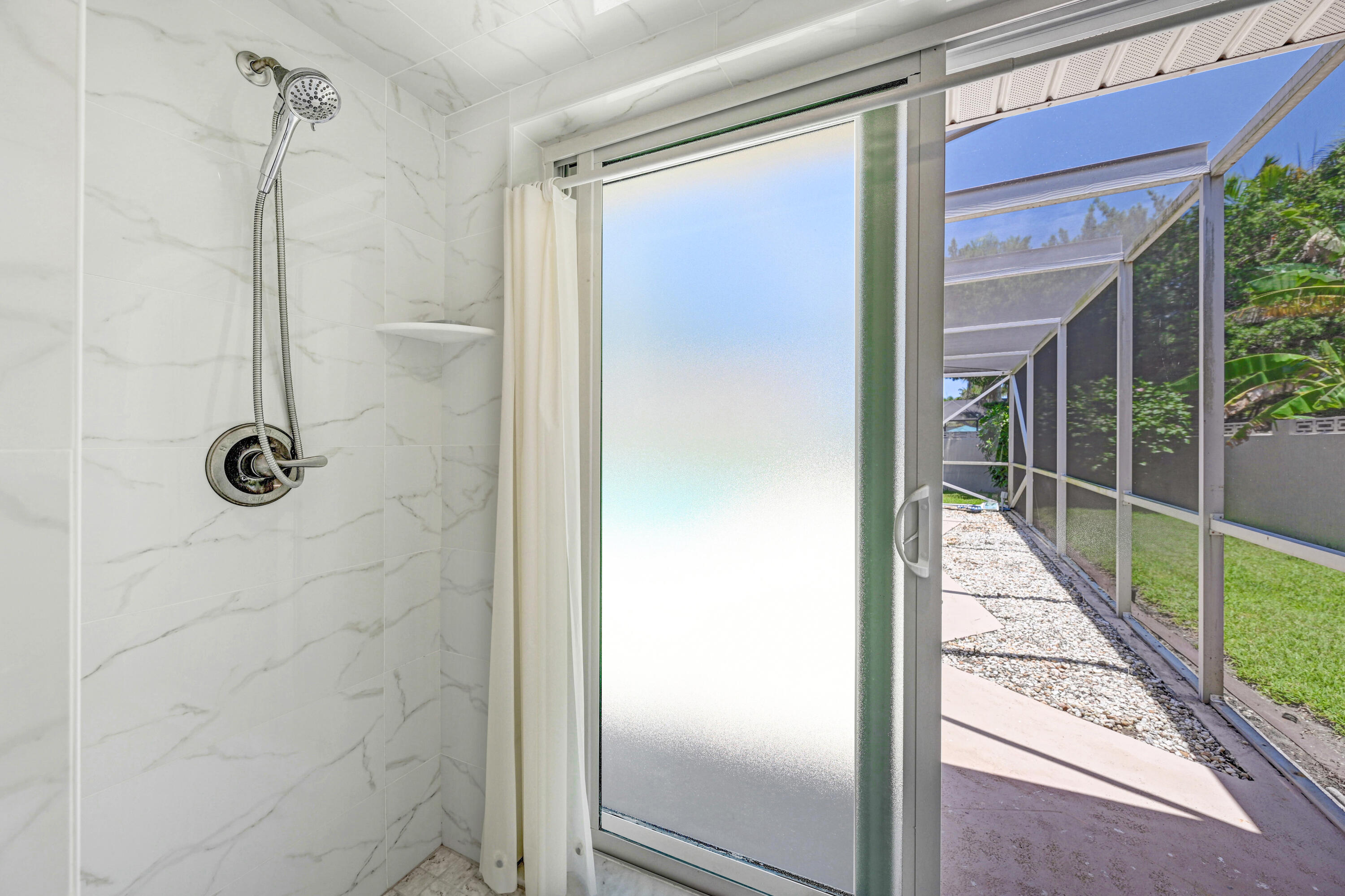 675 Caribbean Road Satellite Beach, FL 32937 - Photo 19 of 35 Primary Shower to Pool