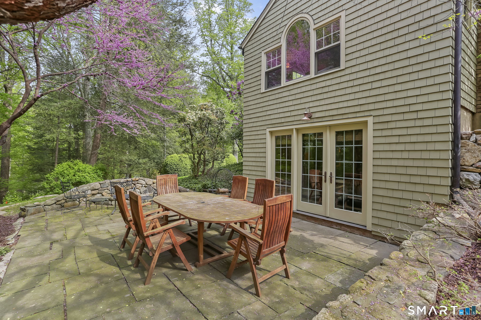 23 Old Stage Coach Road Weston, CT 06883 - Photo 33 of 37 a view of a house with backyard and sitting area