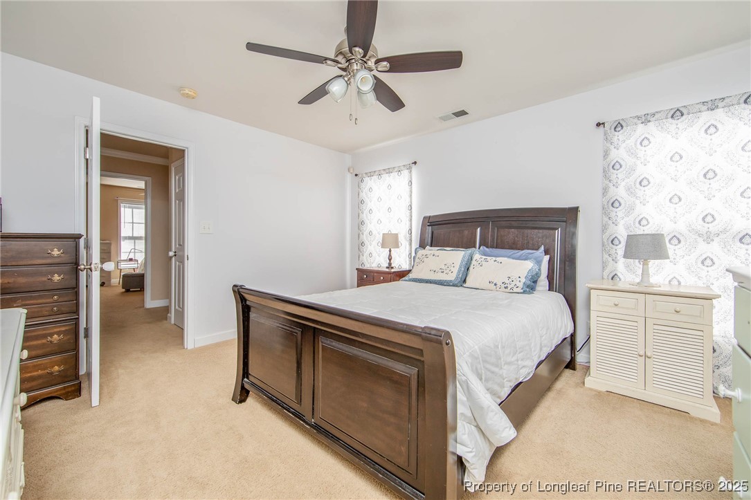 298 Declaration Drive Raeford, NC 28376 - Photo 19 of 31 a bedroom with a bed and cabinets