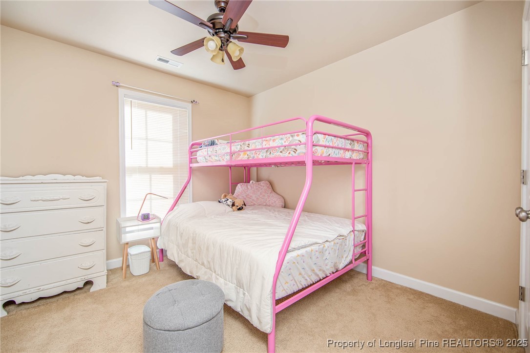 298 Declaration Drive Raeford, NC 28376 - Photo 21 of 31 a bedroom with a bed and a window