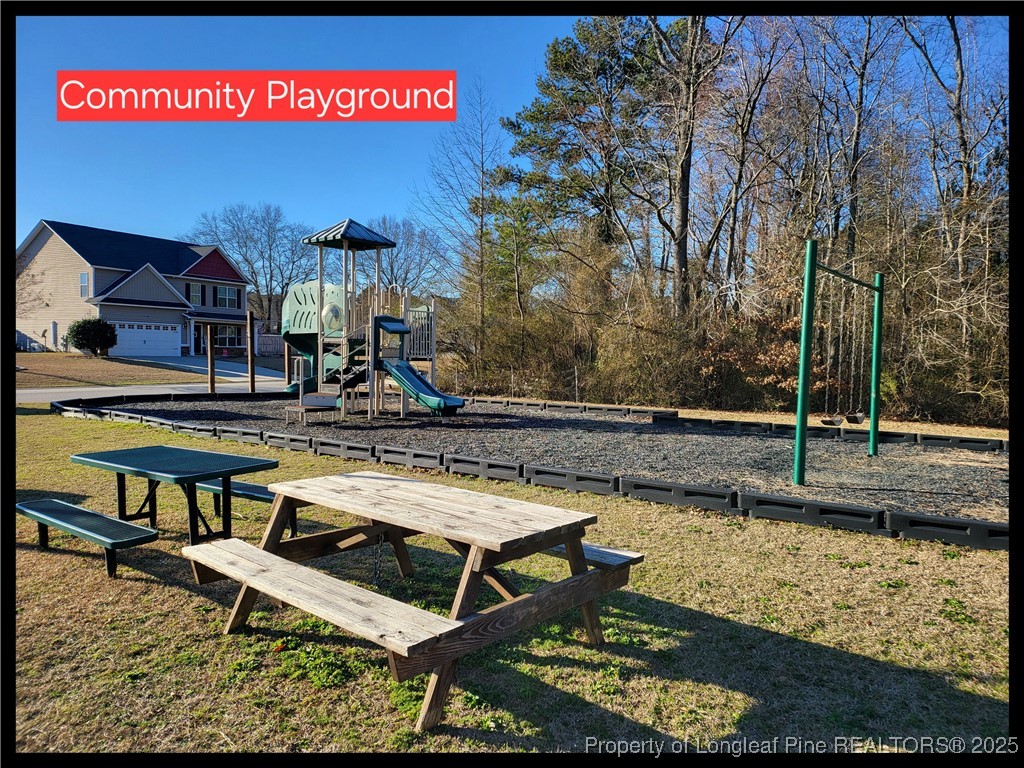 298 Declaration Drive Raeford, NC 28376 - Photo 5 of 31 a view of swimming pool with lawn chairs and wooden fence
