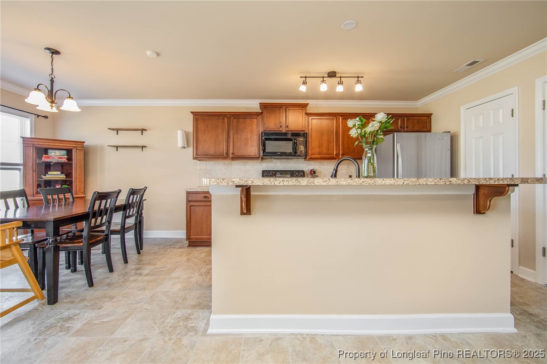 298 Declaration Drive Raeford, NC 28376 - Photo 6 of 31 a view of kitchen with cabinets and wooden floor