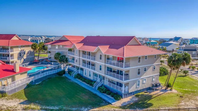 a view of a house with a yard and balcony