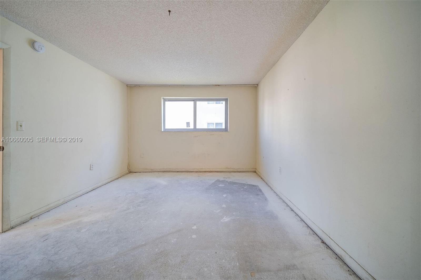 1674 Bay Road, Unit 403 Miami Beach, FL 33139 - Photo 14 of 23 an empty room with a window