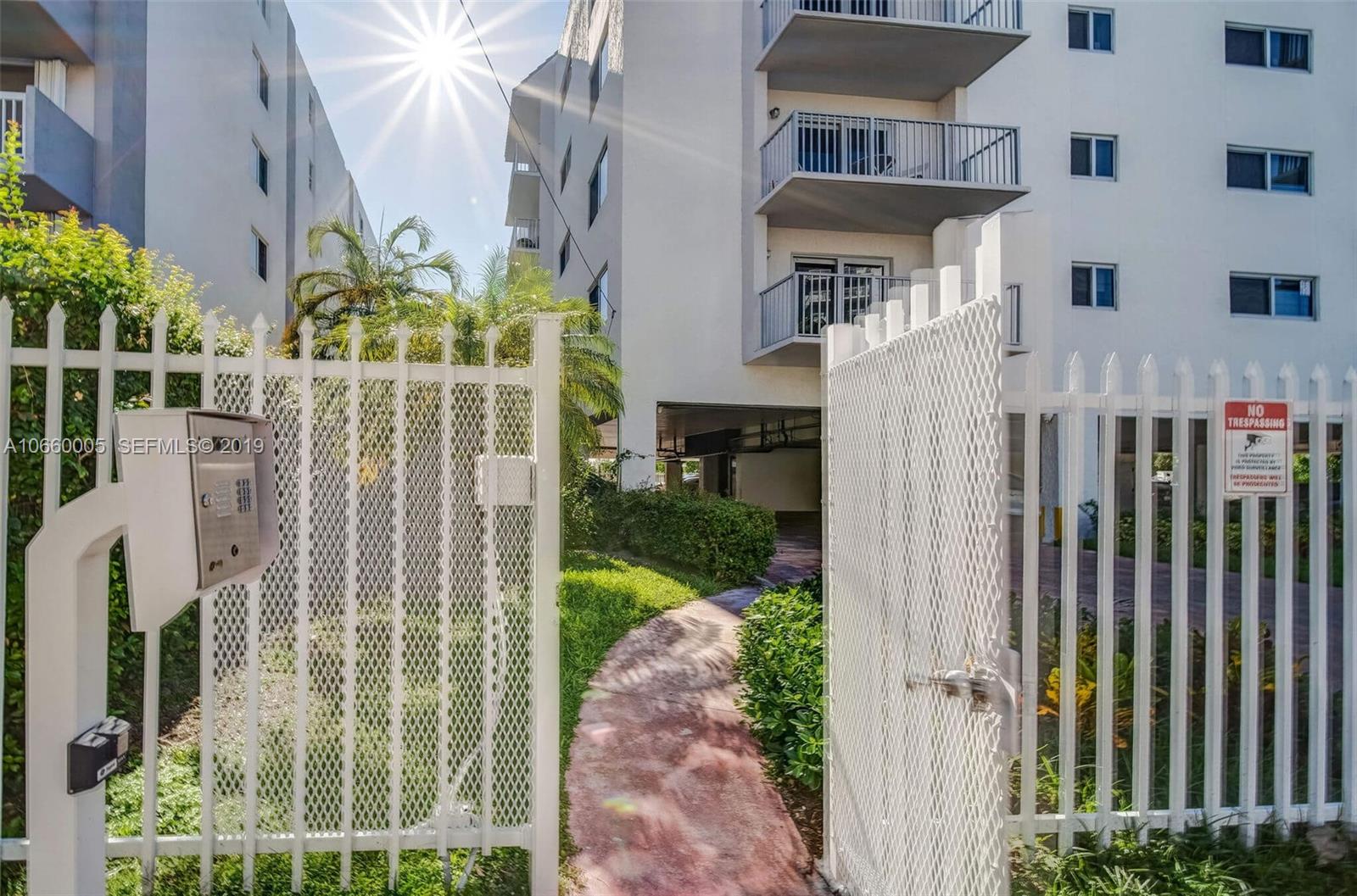 1674 Bay Road, Unit 403 Miami Beach, FL 33139 - Photo 20 of 23 a view of building with glass windows