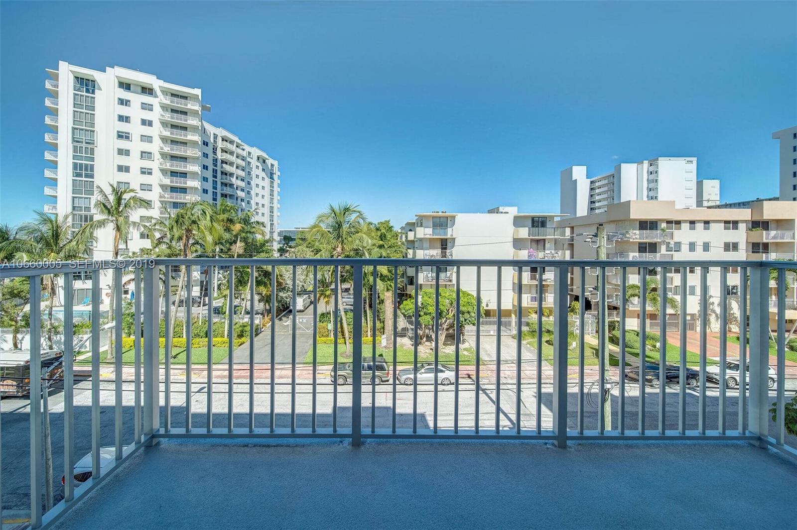 1674 Bay Road, Unit 403 Miami Beach, FL 33139 - Photo 2 of 23 a view of buildings from the balcony