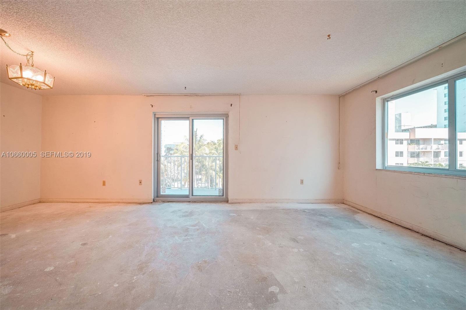 1674 Bay Road, Unit 403 Miami Beach, FL 33139 - Photo 9 of 23 a view of an empty room with a window