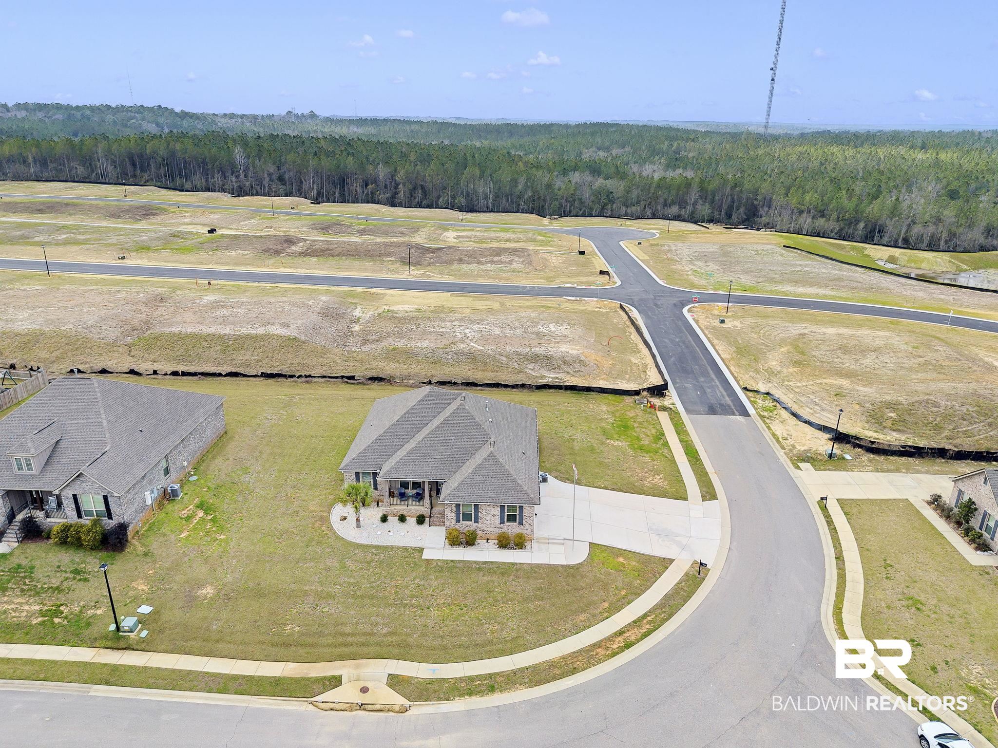 11247 Thistledown Loop Spanish Fort, AL 36527 - Photo 54 of 72 Drone / aerial view featuring a wooded view