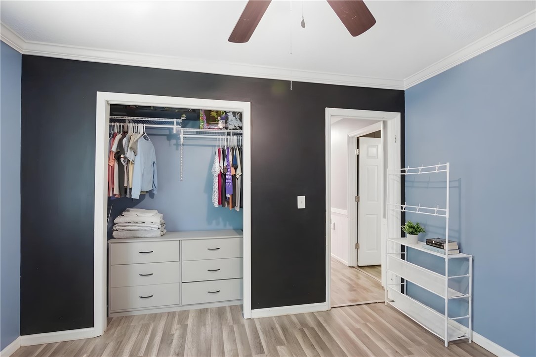 311 Cumberland Way Anderson, SC 29621 - Photo 19 of 44 Well-lit room featuring ample closet storage and hardwood-style flooring.