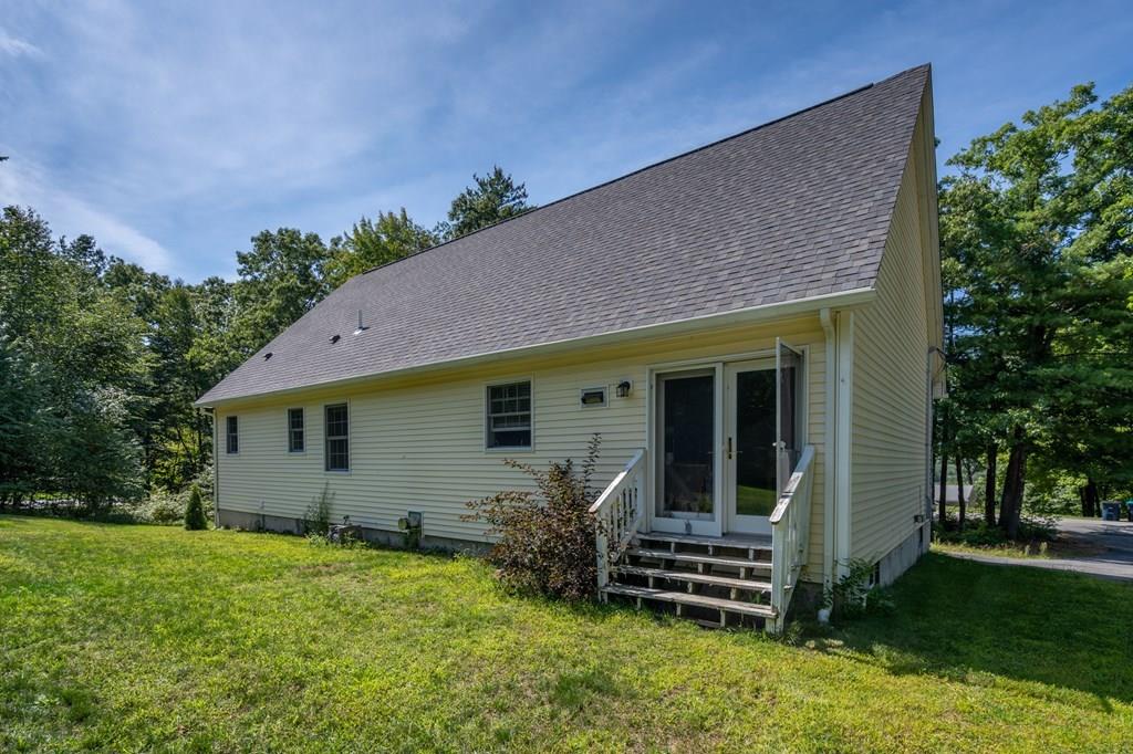 79 Breakneck Road Sturbridge, MA 01566 - Photo 3 of 25 a front view of a house with a garden