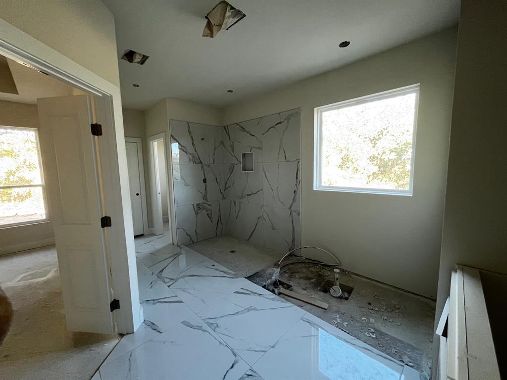 317 Jonny Boy Way Springtown, TX 76082 - Photo 4 of 7 a bathroom with a window and a shower