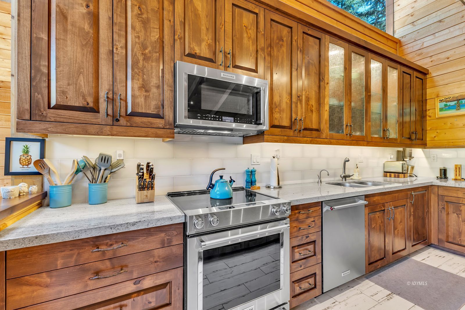 24924 Fern Valley Road Idyllwild, CA 92549 - Photo 27 of 72 a kitchen with stainless steel appliances granite countertop a sink a stove and cabinets