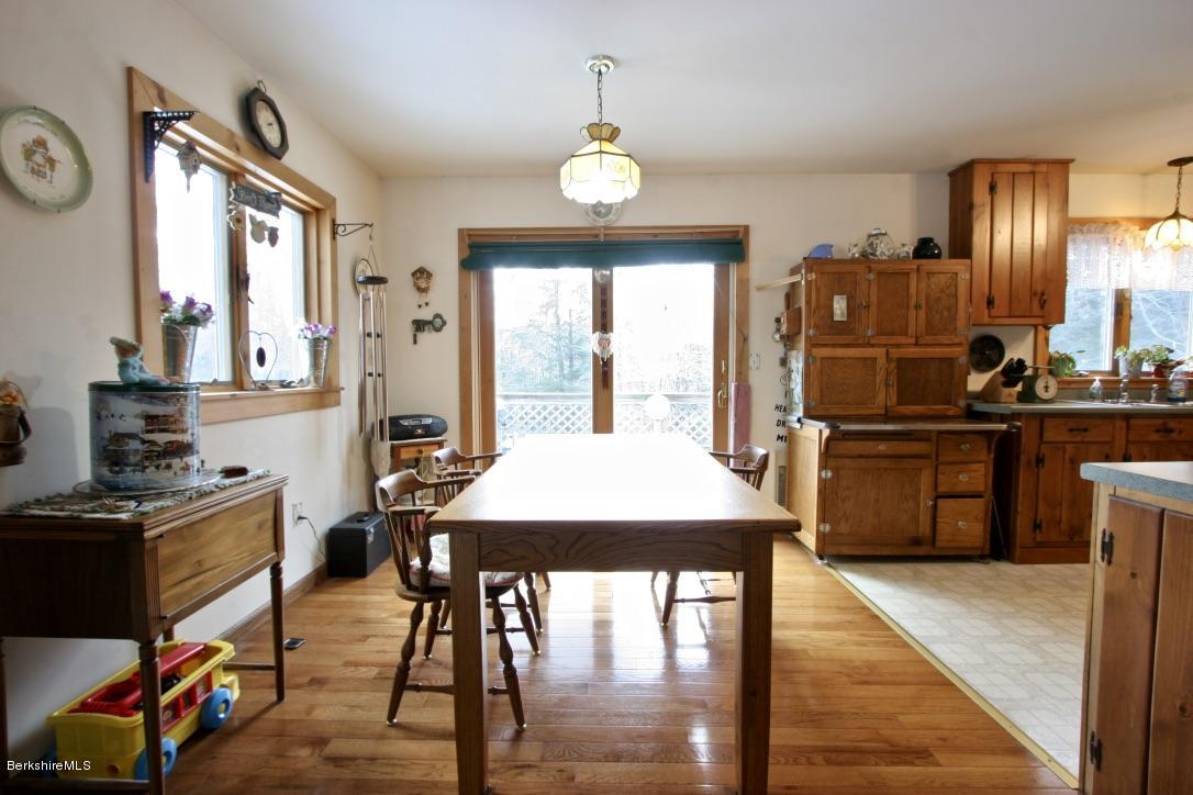 501 Dimmock Road Otis, MA 01253 - Photo 4 of 33 Open dining area with sliders to deck