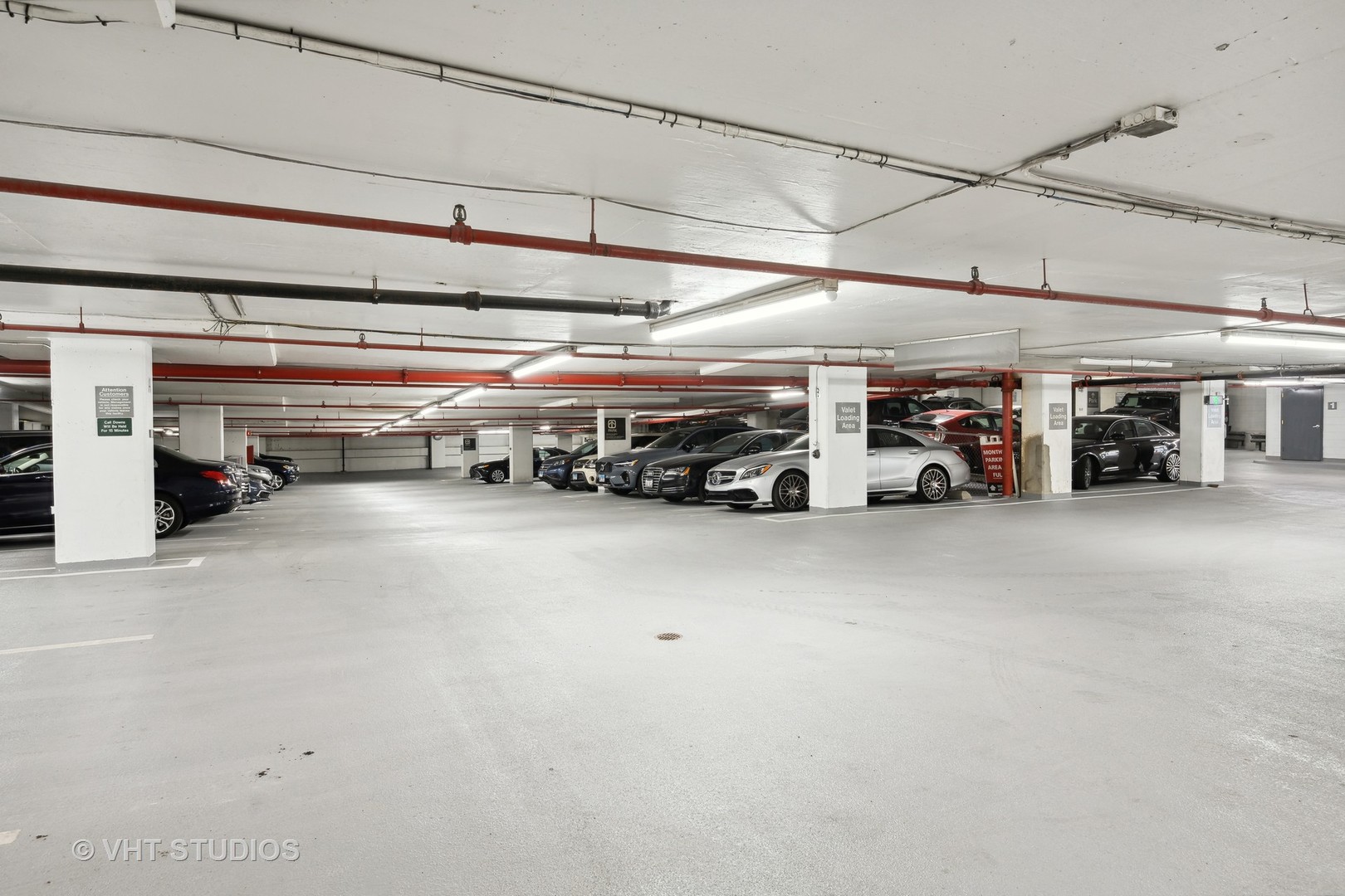 211 East Ohio Street, Unit 609 Chicago, IL 60611 - Photo 19 of 19 a view of parking garage with cars
