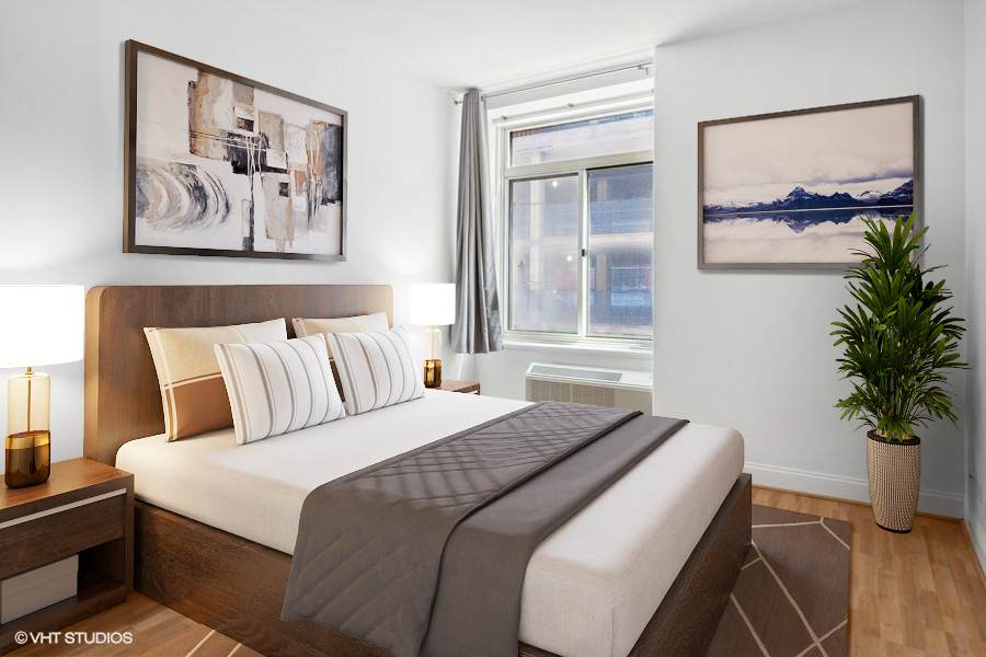 211 East Ohio Street, Unit 609 Chicago, IL 60611 - Photo 4 of 19 a bedroom with a bed and a painting on the wall