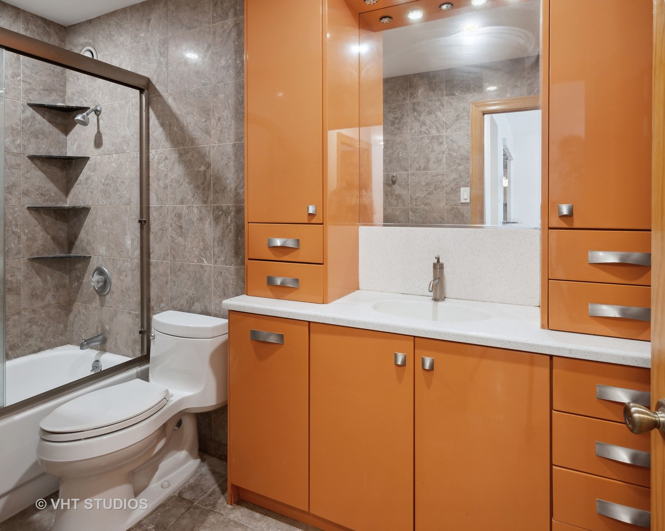 211 East Ohio Street, Unit 609 Chicago, IL 60611 - Photo 7 of 19 a bathroom with a sink toilet and shower