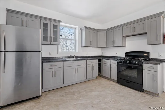 a kitchen with a refrigerator stove and sink