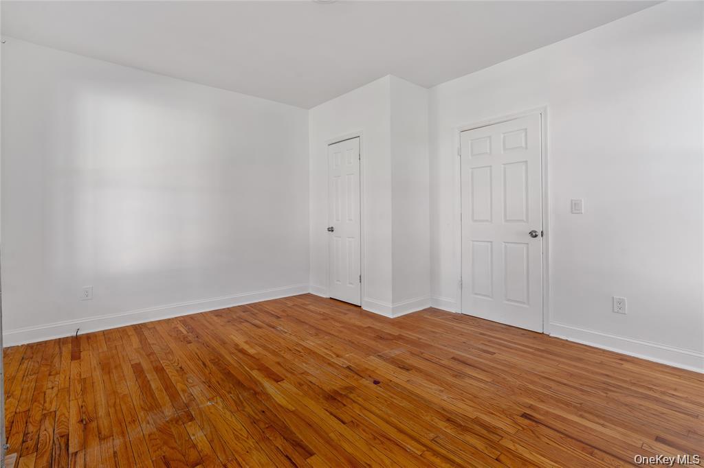 94 Winnikee Avenue, Unit 3 Poughkeepsie, NY 12601 - Photo 5 of 12 a view of empty room with wooden floor