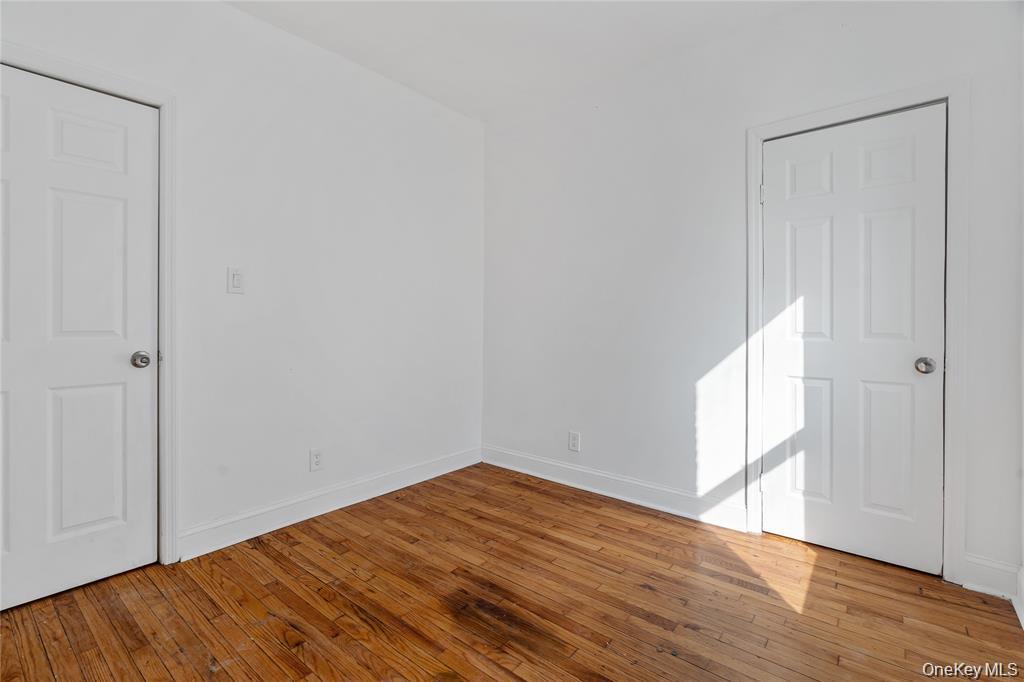 94 Winnikee Avenue, Unit 3 Poughkeepsie, NY 12601 - Photo 9 of 12 a view of empty room with wooden floor and fan