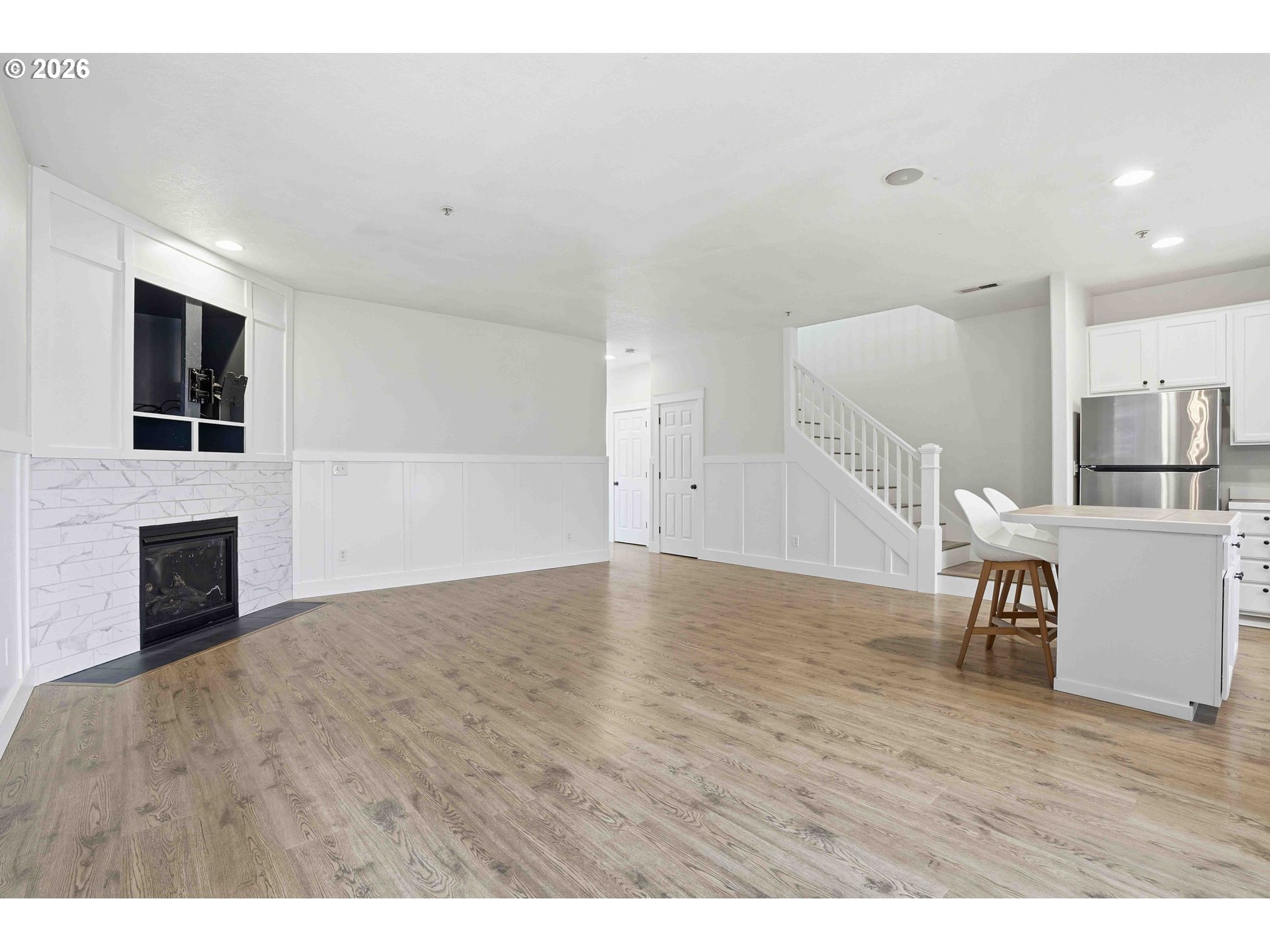3323 Northwest 31st Circle Camas, WA 98607 - Photo 14 of 25 a view of empty room with wooden floor and fireplace