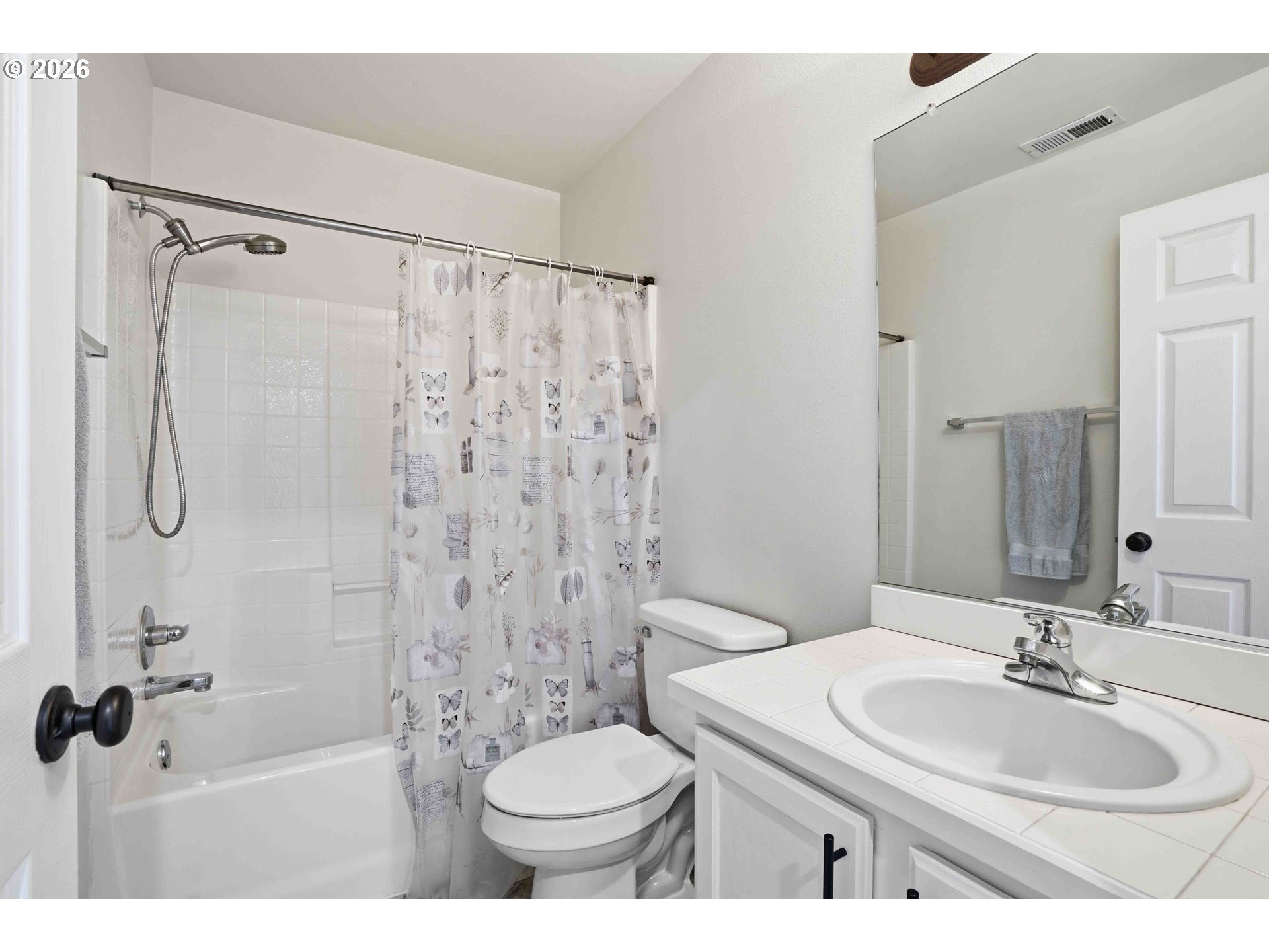 3323 Northwest 31st Circle Camas, WA 98607 - Photo 20 of 25 a bathroom with a sink toilet a mirror and shower