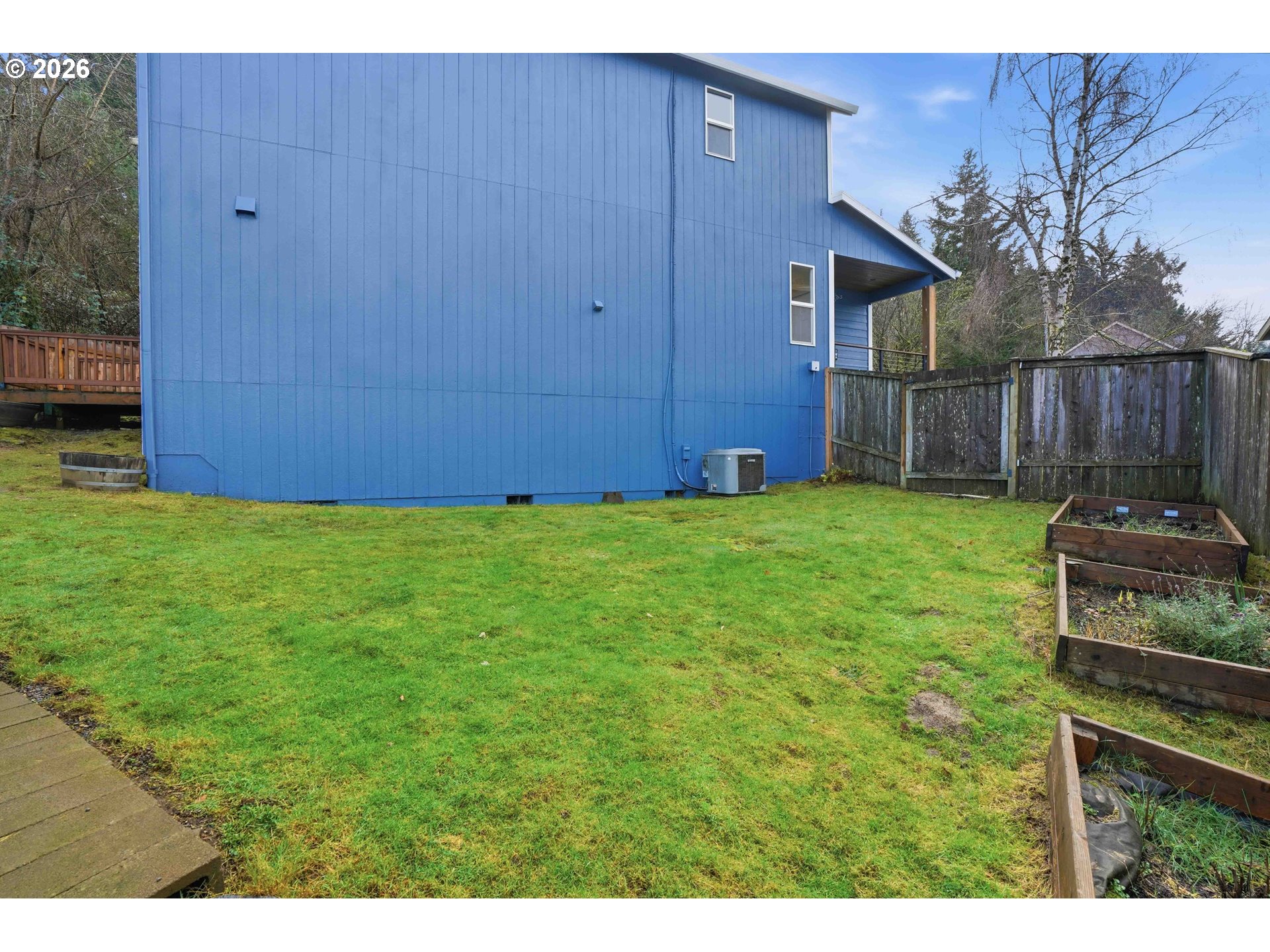 3323 Northwest 31st Circle Camas, WA 98607 - Photo 23 of 25 a view of a backyard with potted plants and wooden fence