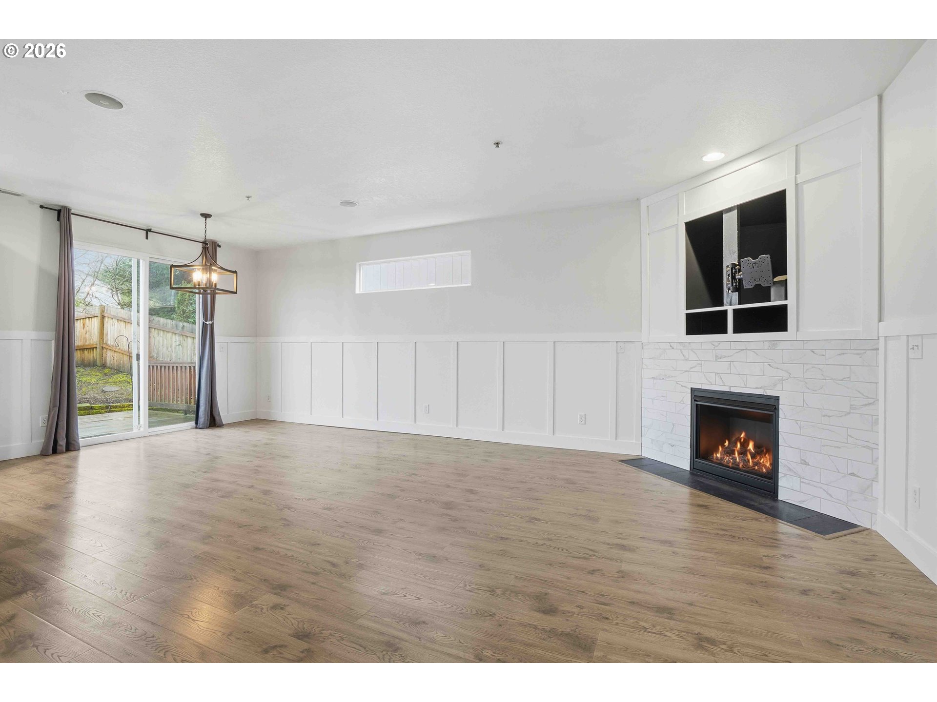 3323 Northwest 31st Circle Camas, WA 98607 - Photo 6 of 25 a view of a livingroom with wooden floor and a fireplace